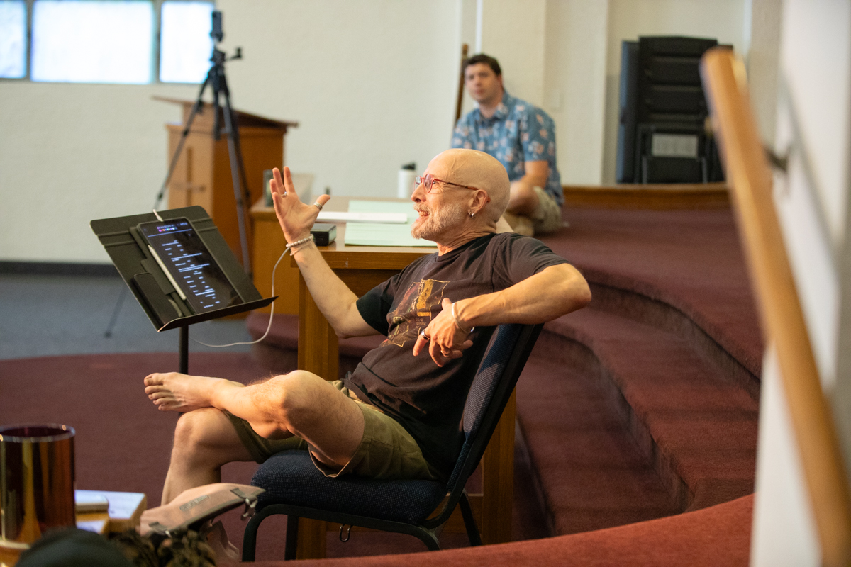 Director Bruce Akpan Hostetler (foreground) with librettist Joel Cobbs in rehearsal