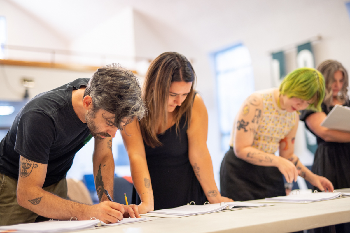 Documentarians Harvey and Lucy, with Charlie and Bonnie, making script changes